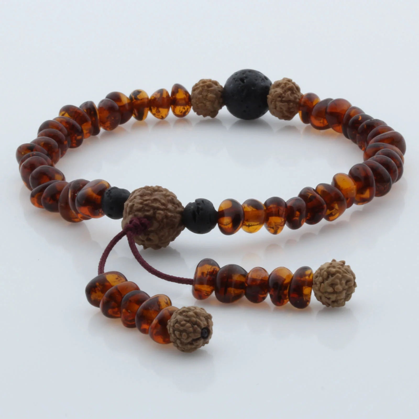 Adult Baltic Amber Bracelet with Lava Stone Mala Tassel. MS01