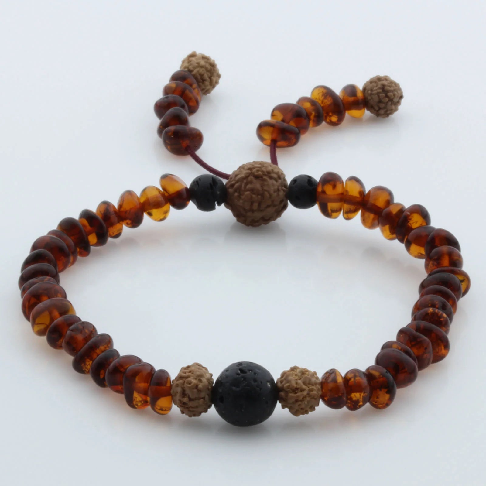 Adult Baltic Amber Bracelet with Lava Stone Mala Tassel. MS01